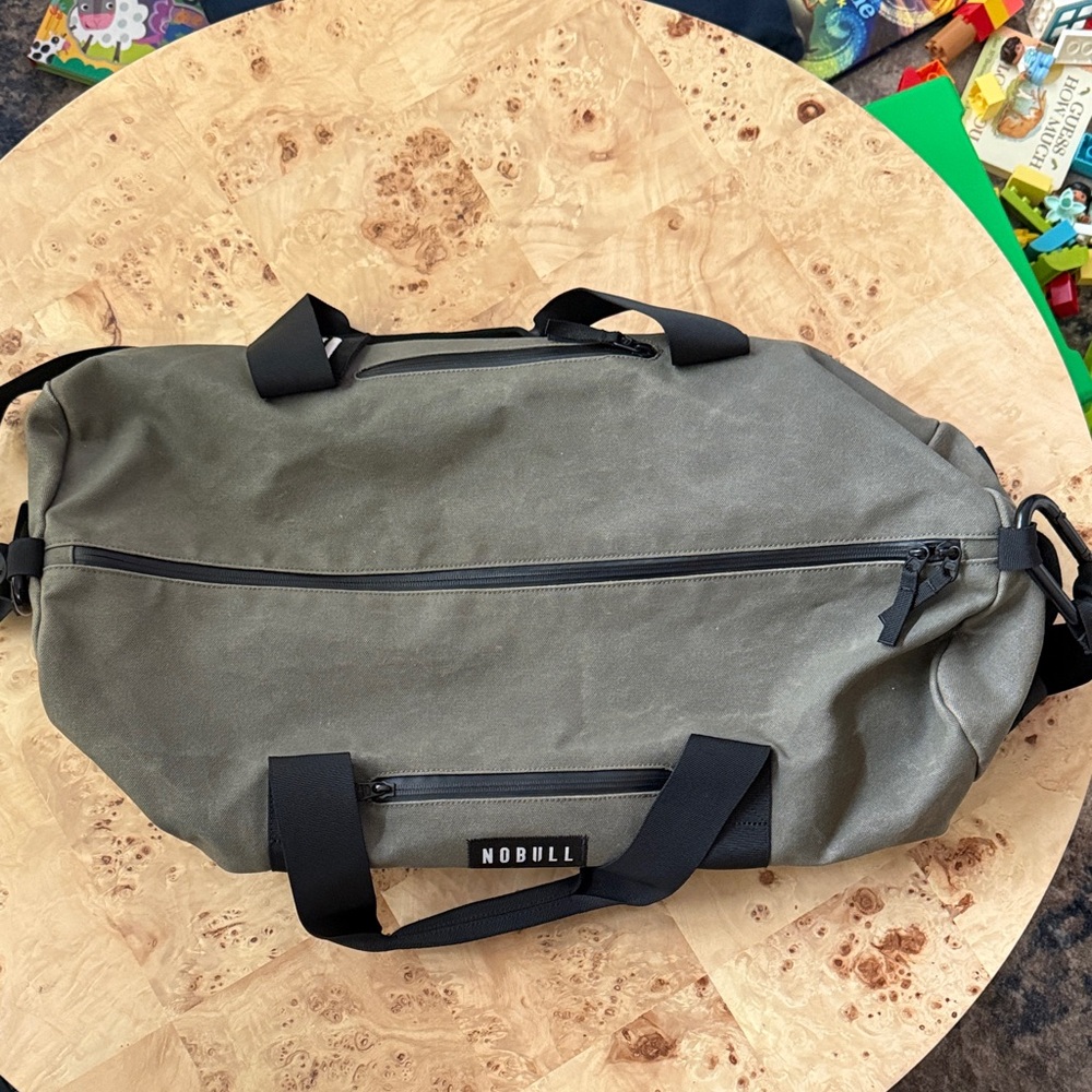 NOBULL olive green waxed canvas duffle bag